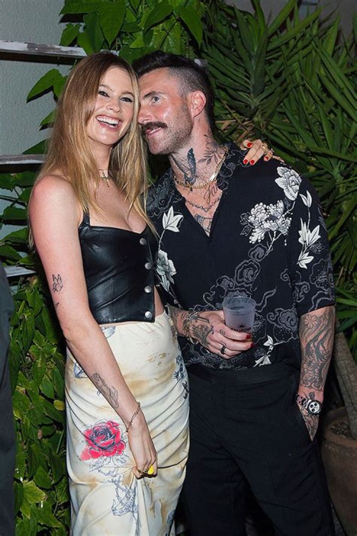 Behati Prinsloo Kisses Adam Levine As They Celebrate His 44th Birthday At Disneyland: Photos