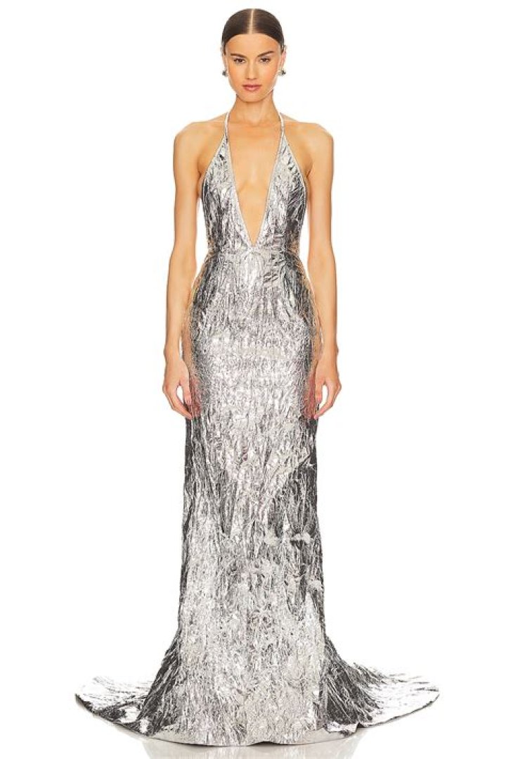 Dua Lipa Dazzles in Silver Metal Plunging V-Neck Gown at the 2024 Grammys: Photos