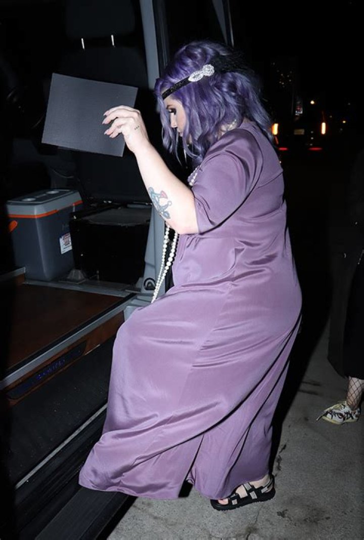 Kelly Osbourne Shows Off Baby Bump In Purple Dress For Sharon’s 70th Birthday Party