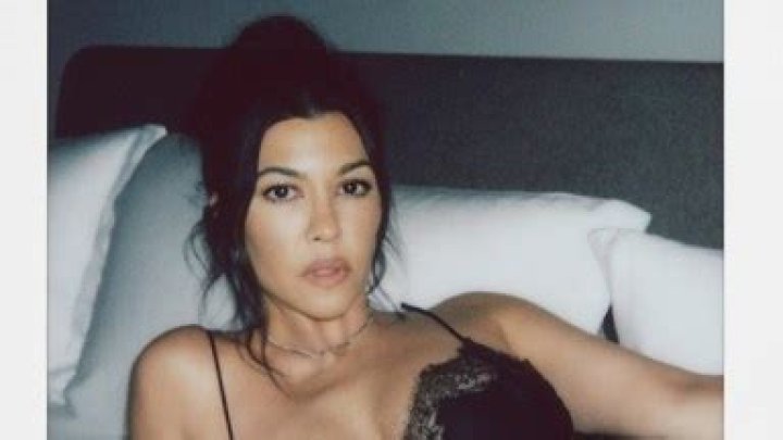 Kourtney Kardashian Rocks Lacy Slip Dress In Bed For Collab With Travis Barker’s Wellness Brand