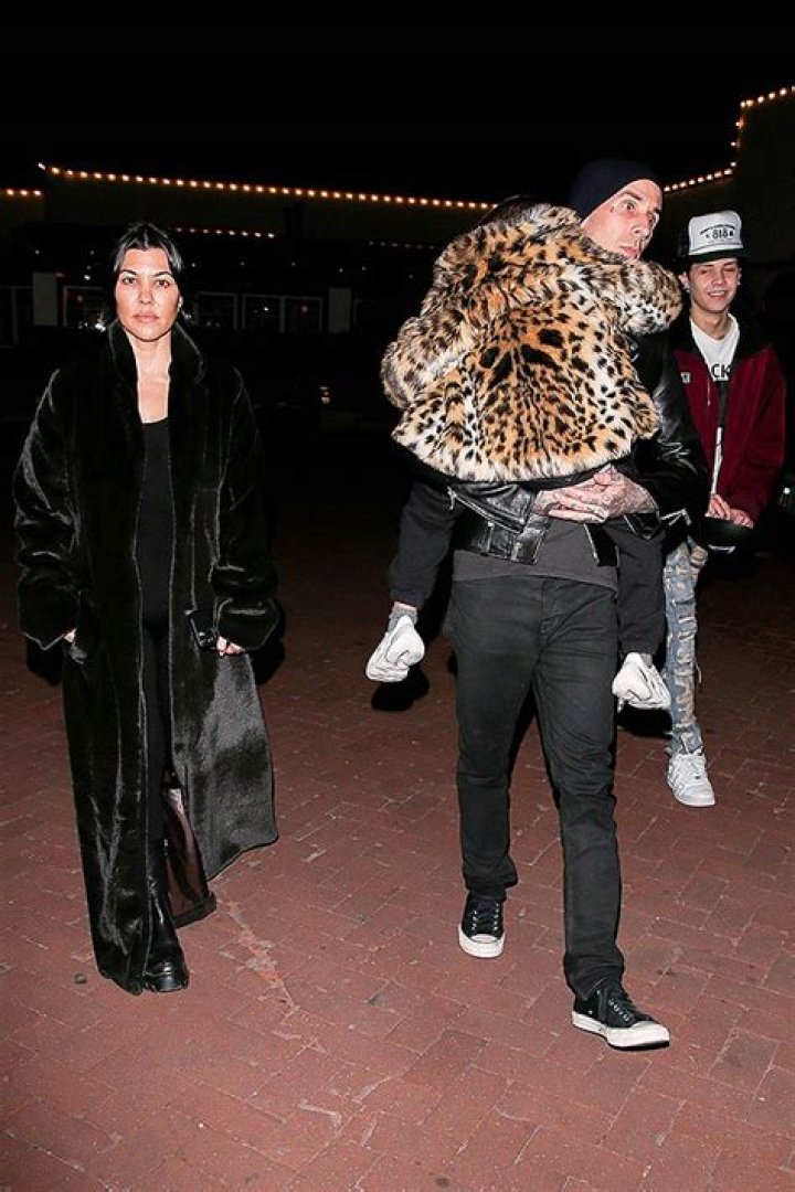 Travis Barker Sweetly Holds Reign, 7, On Malibu Dinner Date With Kourtney Kardashian